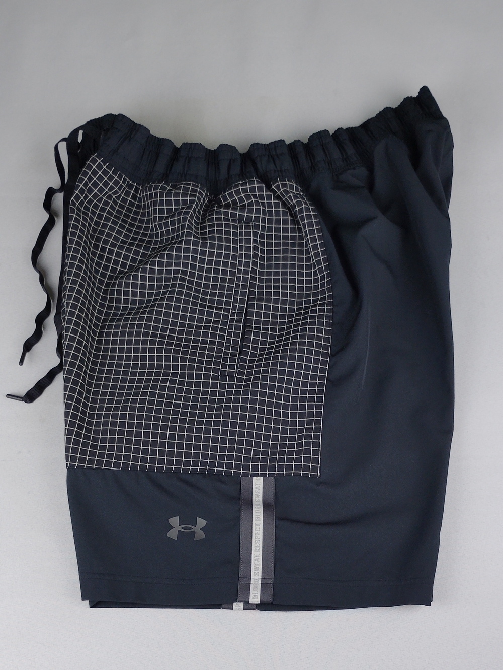 Under Armour Men’s Black Grid-Print Athletic Shorts.